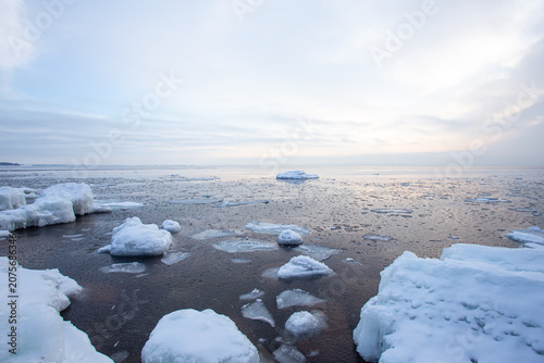 Arctic Sunrise at Frozen Partly open Waters with Melting Ice Floating