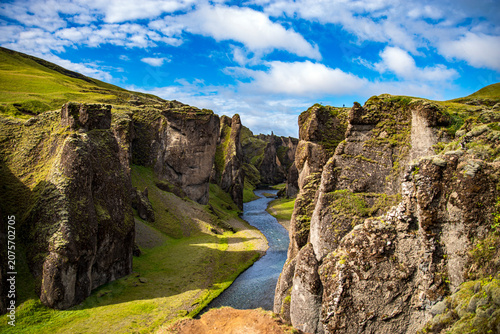 Fjadrargljufur canyon with green mossy cliffs and river, Iceland