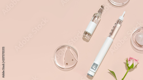 Beauty Injection Concept with Syringe Pen, Glass Vial, and Cosmetic Tools on Soft Pink Background with Copy Space, for Aesthetic Medicine, Anti Aging Treatments, Skin Rejuvenation and Wellness Clinics
