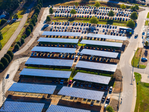 Photovoltaic solar panels over car parking lot in Clemson, South Carolina for generation of renewable energy. Sustainable power production integrated in urban infrastructure.