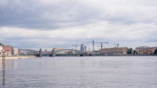  Saint Petersburg, Russia, June 27, 2026. Bolshoy Okhtinsky Bridge and embankment in summer.                              
