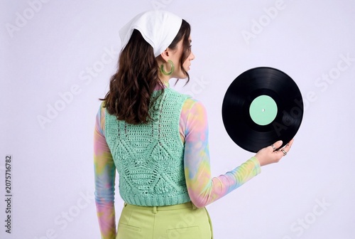 Woman with Vinyl Record and Crochet Top in Retro Style against Purple Background