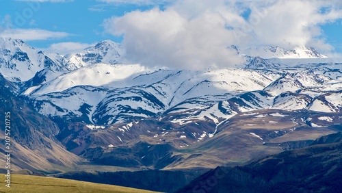Photos Dzhily Su, Russia - June 4, 2026: Scenic view of snow-covered peaks in the Cauca