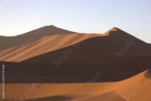 Majestic Red Sand Dunes at Golden Hour in Namib Desert, Sossusvlei, Namibia - Dramatic Light and Shadow Landscape