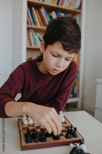 Boy is playing chess