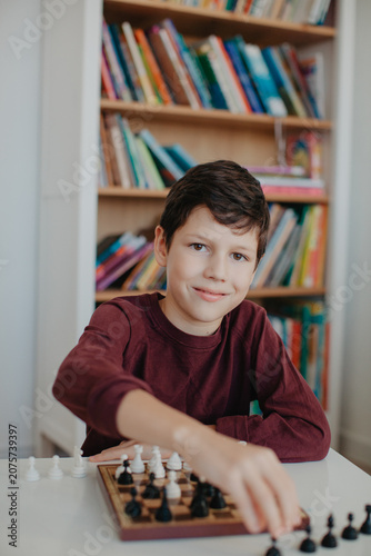 Boy is playing chess