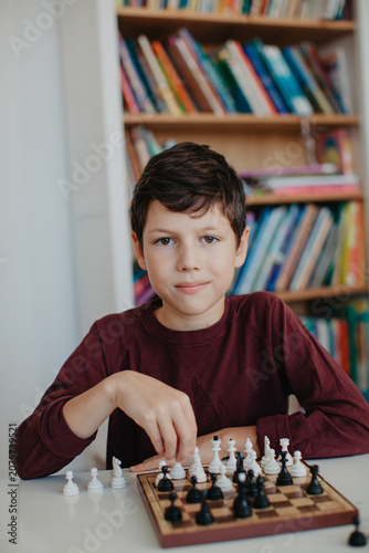 Boy is playing chess