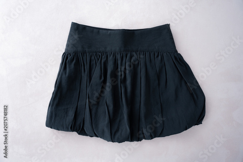 Black mini skirt balloon trend summer 2024. Fast fashion concept. High quality photo