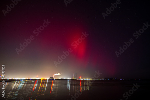 The Northern Lights in Dublin, Ireland. Red lights above the Poolbeg Chimneys in Dublin Bay
