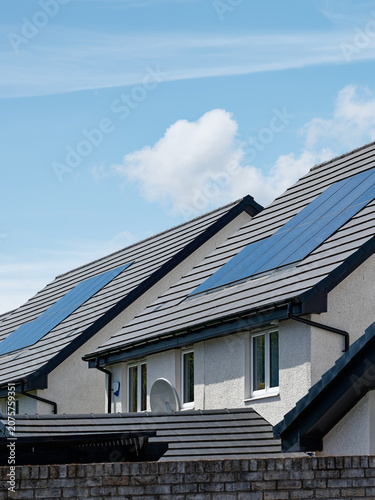 Solar panels installed on home roofs at new housing development