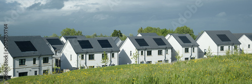 Solar panels installed on home roofs at new housing development