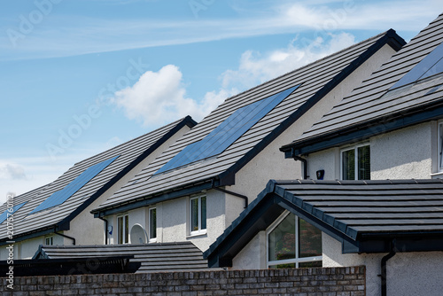Obraz na plátně Solar panels installed on home roofs at new housing development