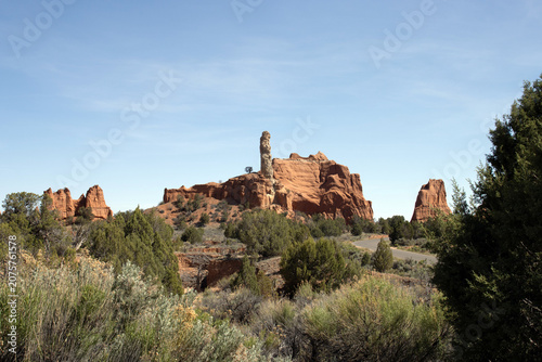 A road winds through sandstone formations and native plants at Kodachrome Basin State Park in Utah