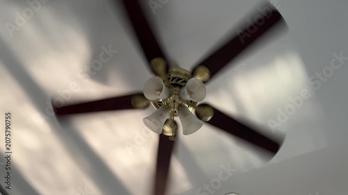 Watching a Ceiling Fan Spin in Quiet Home Setting