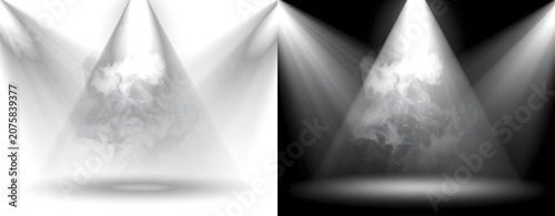 Spotlights shining down on a foggy stage.
