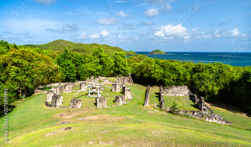 The historic ruins of Chateau Dubuc on the scenic Caravelle Peninsula in Martinique surrounded by lush green nature and the blue ocean