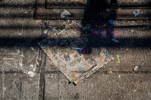 Fotografija Discarded Newspaper and Litter on Brooklyn Sidewalk Curb