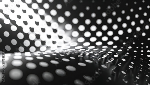 A dark surface with a pattern of glowing white dots curves and undulates.