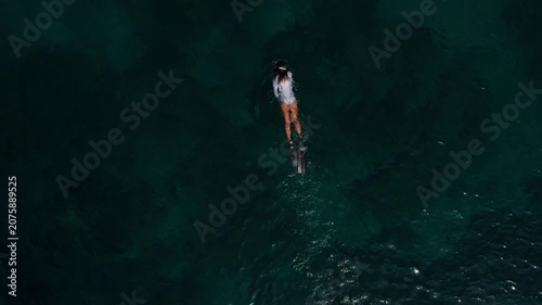 Aerial View of Freediver Swimming with Fins in Clear Tropical Ocean Water