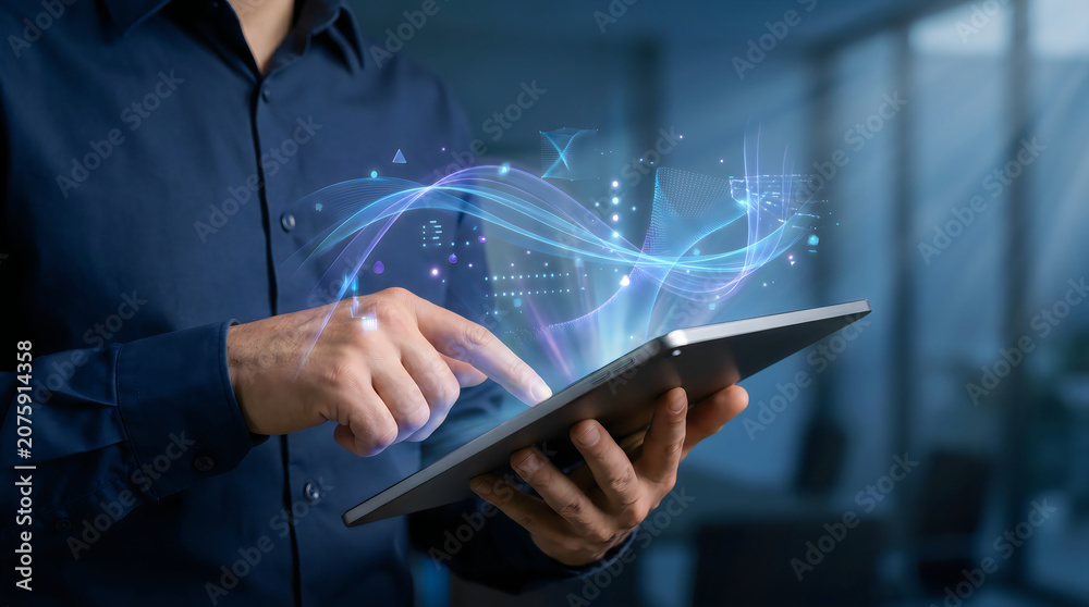 © sohel - Business professional holding tablet with digital network hologram overlay © sohel - Business professional holding tablet with digital network hologram overlay