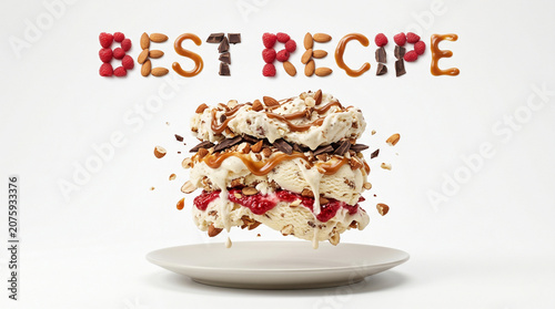 Levitating multi layered dish ice cream and BEST RECIPE text made of organic ingredients above a plate, conceptual food photography on white background