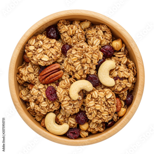 Golden-brown whole grain granola with toasted oats, almonds, pecans, cashews, cranberries, blueberries in a wooden bowl on white background, copy space, concept of natural healthy food