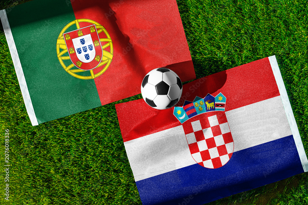 Naklejka premium Portugal vs Croatia, national flags before international football tournament Round of 32 match, football on green grass with goal in the background, Toronto, Ontario, Canada, July 2, 2026