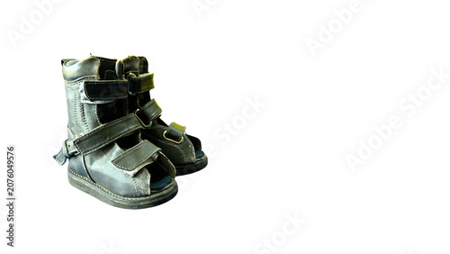 Photos Pediatric orthopedic corrective boots on isolated transparant background