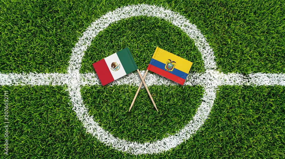 Obraz premium Top Down Aerial View of Mexico and Ecuador Flags on Soccer Field Center Circle