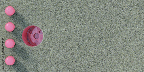 Fotografie Pink balls aligned on rough texture surface beside circular recess forming abstract geometric layout on wide background suitable for banner design