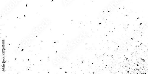 Quadro su tela Black grunge texture with scattered particles on white background vector graphic