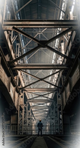Industrial Bridge Structure with Silhouette of Person Standing, Perspective View.