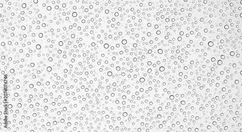 Black circles on white background with varying sizes and densities