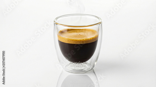 Εκτύπωση καμβά Hot espresso coffee in double wall glass cup with crema and steam rising isolated on white background studio shot