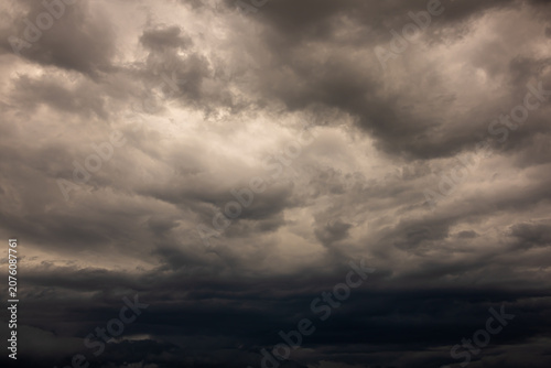 Dramatic Dark Storm Clouds Covering the Sky Before Heavy Rain. Dark, dramatic storm clouds gathering across the sky before heavy rainfall. A powerful weather background featuring dense cloud formation