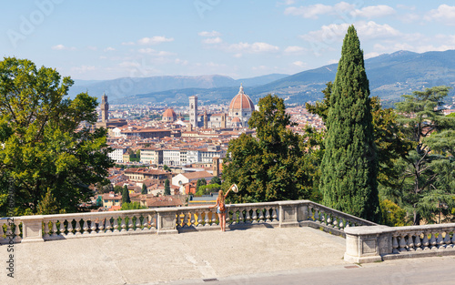 Female tourist looking at Florence cityscape from panoramic terrace in Italy