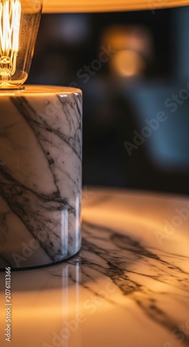 Elegant Marble Lamp with Warm Light and Shadow on a Table.