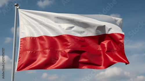 Polish National Flag Waving Against a Clear Blue Sky.