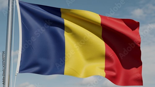 National Flag of Romania Waving in the Wind Against a Cloudy Sky.
