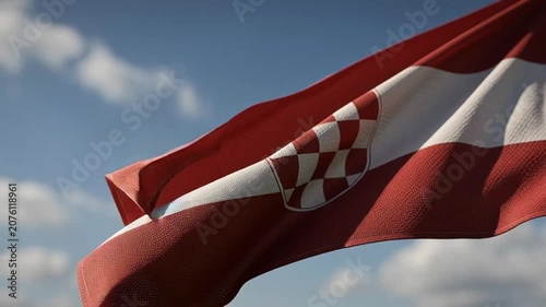 Croatian National Flag Waving in the Wind Against a Blue Sky.
