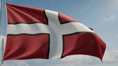 Danish Flag Waving in the Wind Against a Clear Blue Sky.