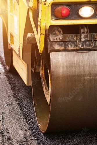 Asphalt Paving Project Underway on City Street With Heavy Machinery Working