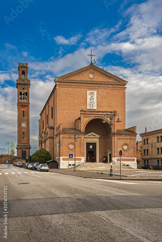 view of the Cathedral of San Mauro with the high bell tower in Cavarzere, Venice, Italy