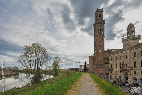 view of the village of Cavarzere from the bank of the Adige river, Venice, Italy