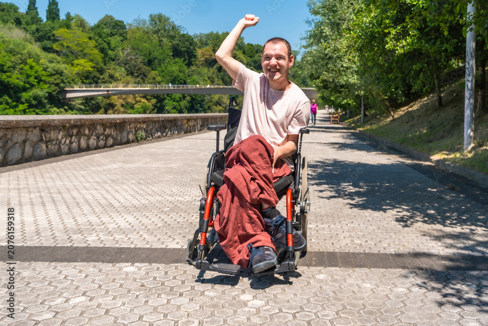 Fototapeta premium Disabled man celebrating victory outdoors in park
