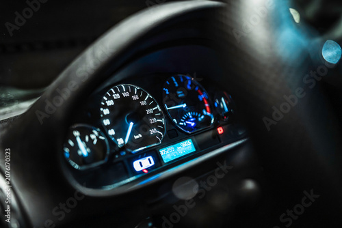 Photos Car dashboard glowing blue displaying speed at night
