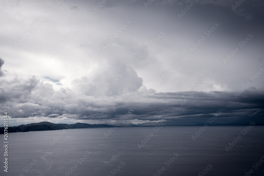 Fototapeta premium View of Lake Titicaca from Amantani Island under stormy clouds