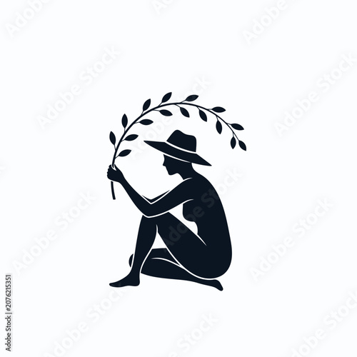 Elegant silhouette of woman with hat holding leafy branch.