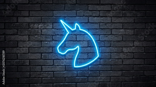 Glowing neon unicorn head silhouette on dark brick wall background with silhouette mystical mythical creature electric illustration mysterious decorative atmosphere isolated colorful