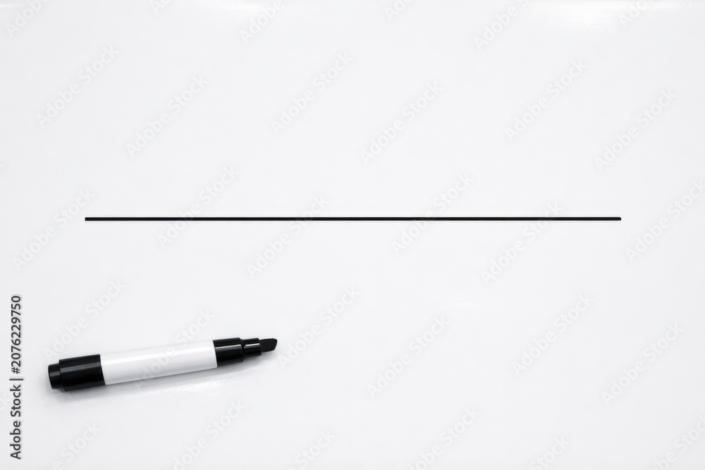 Fototapeta premium A white refrigerator with a black marker drawn on its surface